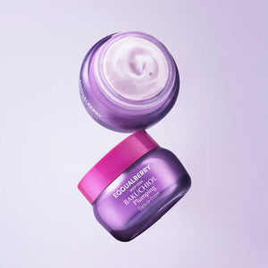 Two jars of skincare cream with visible brand name on a light purple background