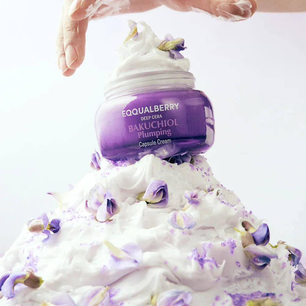 Purple skincare product with white cream on a white background